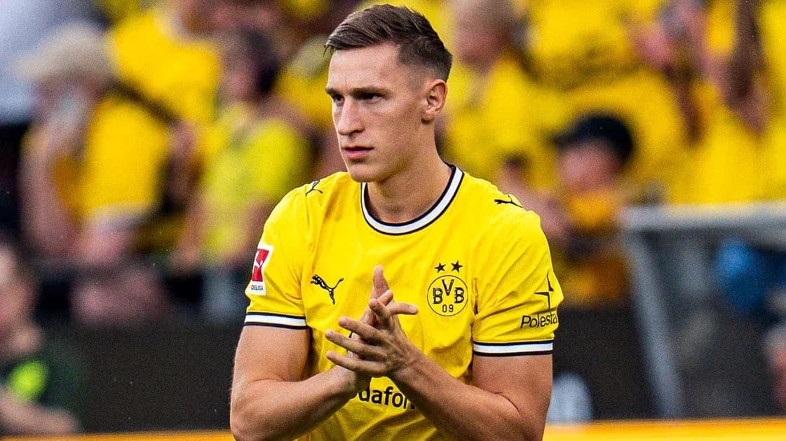 Player in yellow jersey clapping to fans Player in yellow jersey clapping to fans