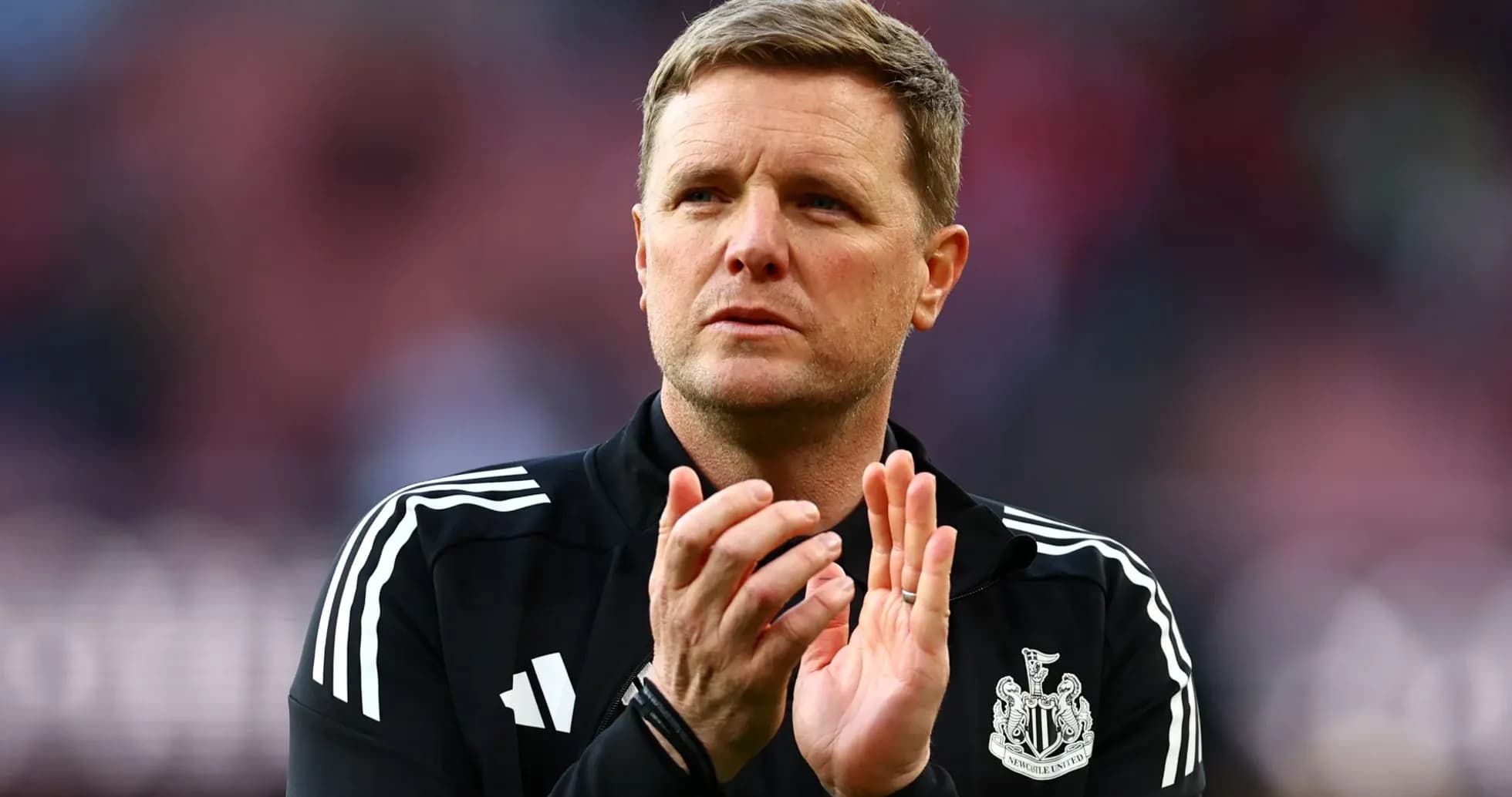 Manager clapping during match on the sidelines Manager clapping during match on the sidelines