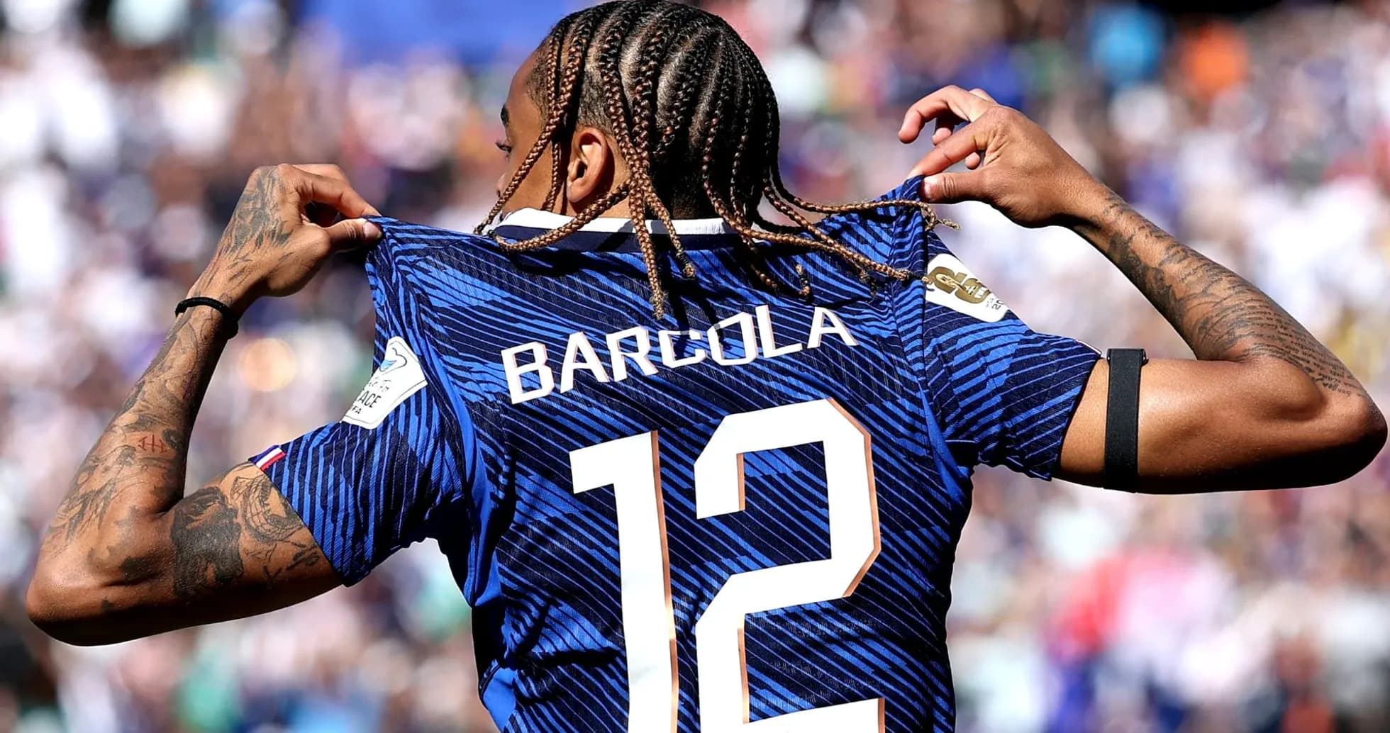 Player showing jersey with name Barcola and number 12 Player showing jersey with name Barcola and number 12
