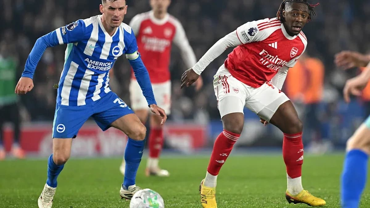 Brighton and Arsenal players contesting possession of the ball Brighton and Arsenal players contesting possession of the ball