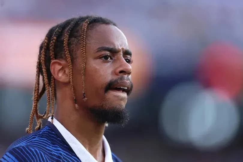 Player with braided hair during match warm-up Player with braided hair during match warm-up