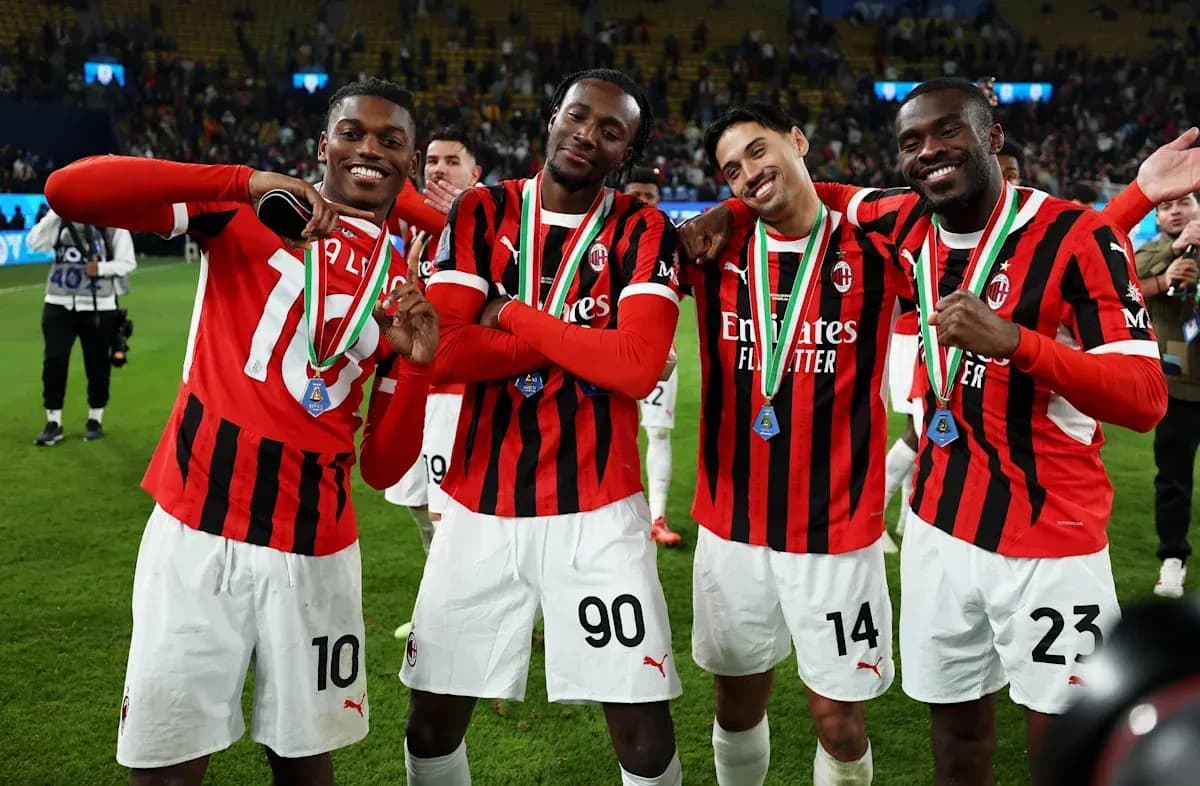 AC Milan players celebrating with medals after victory AC Milan players celebrating with medals after victory