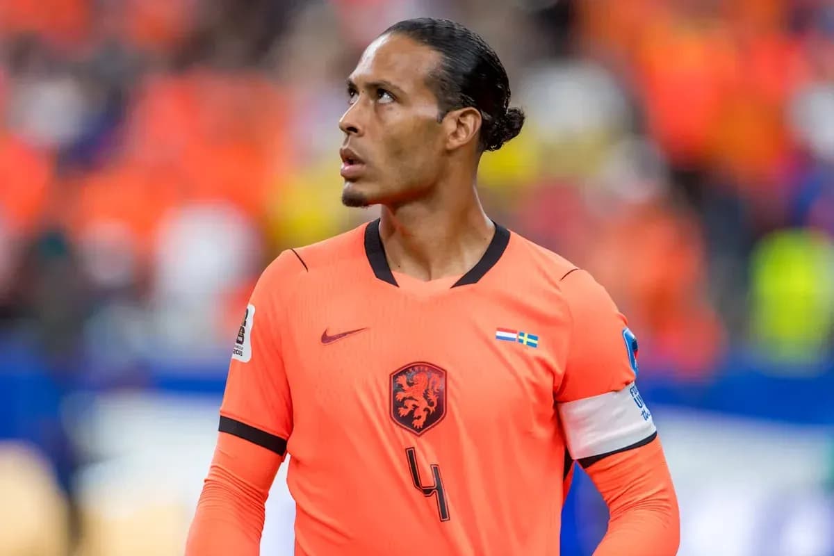 Player in orange jersey looking up during match Player in orange jersey looking up during match