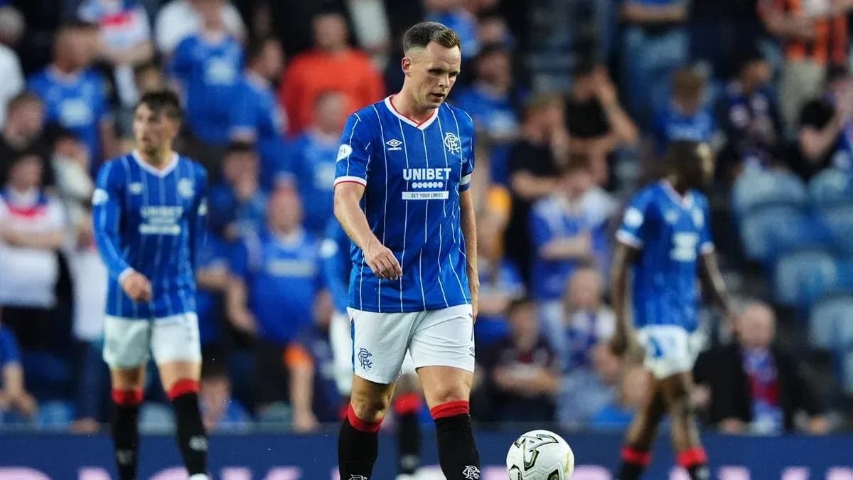 Rangers player walking on pitch during match Rangers player walking on pitch during match