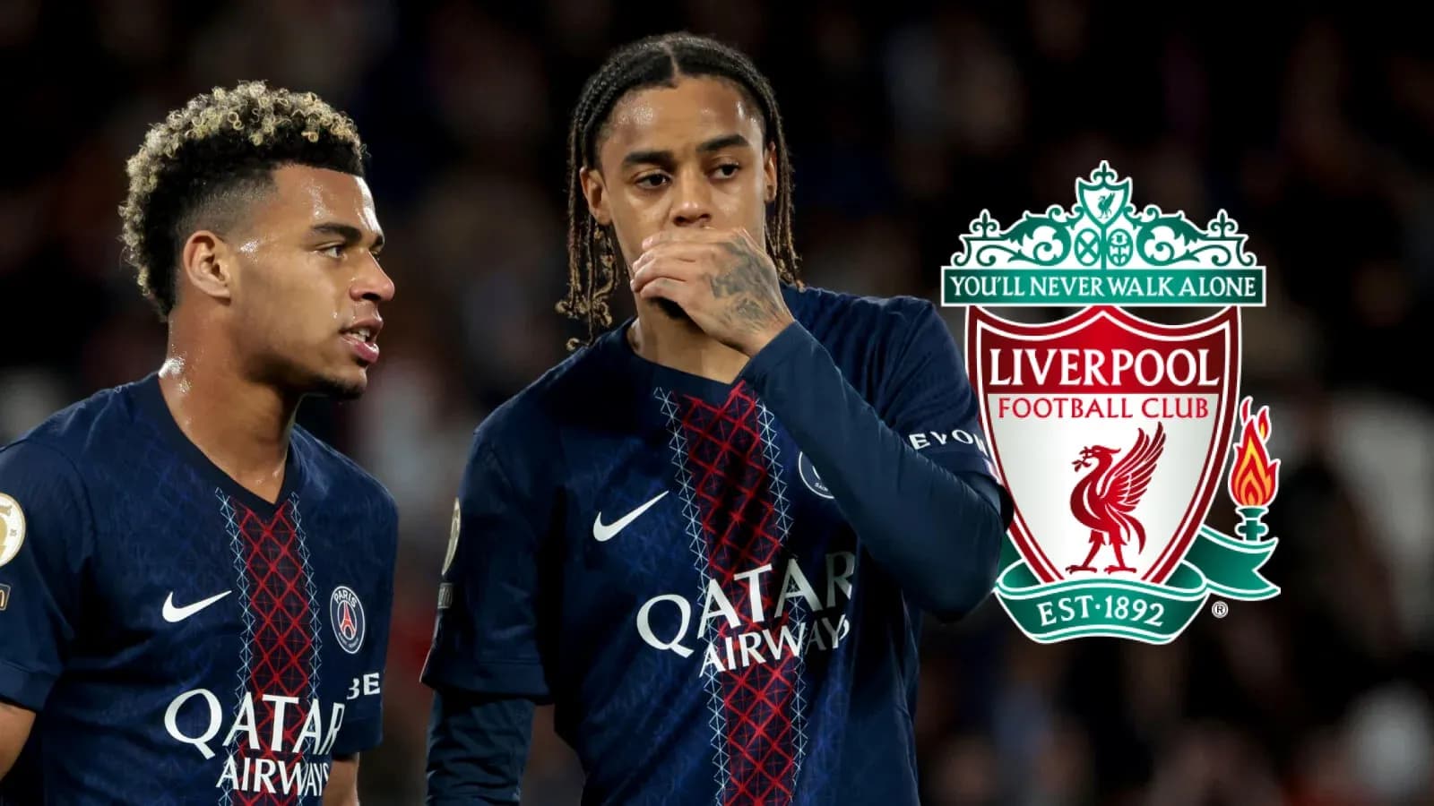Two players in PSG jerseys discussing during match Two players in PSG jerseys discussing during match