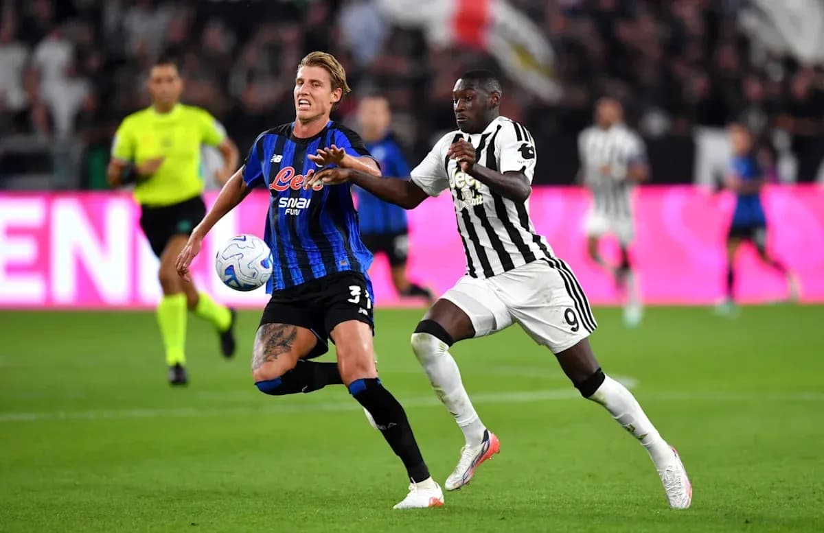 Player contesting the ball during a football match Player contesting the ball during a football match