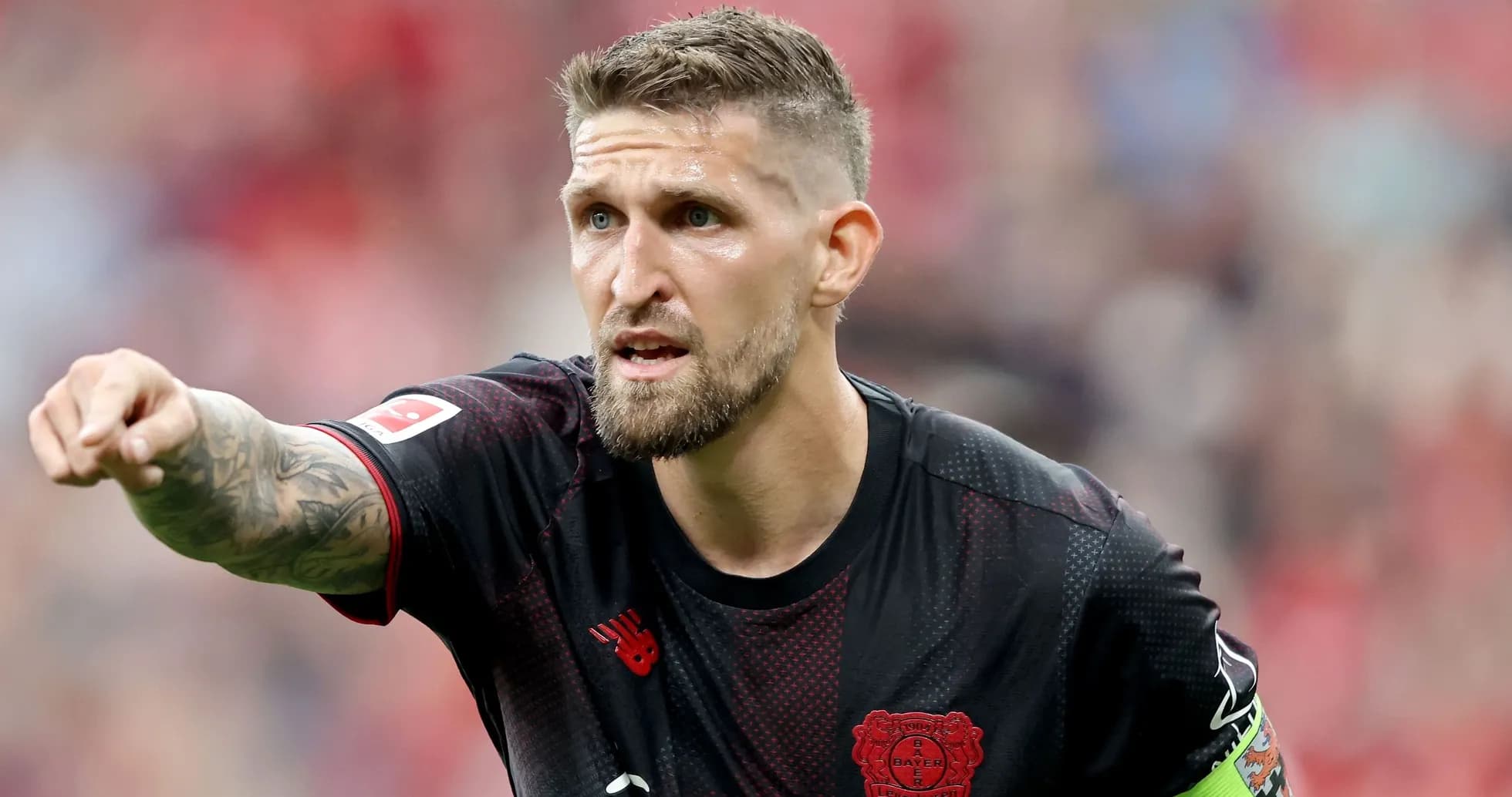 Player gesturing during a football match Player gesturing during a football match