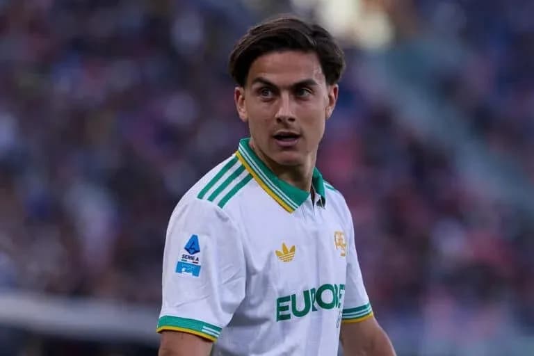 Player in white jersey during football match Player in white jersey during football match