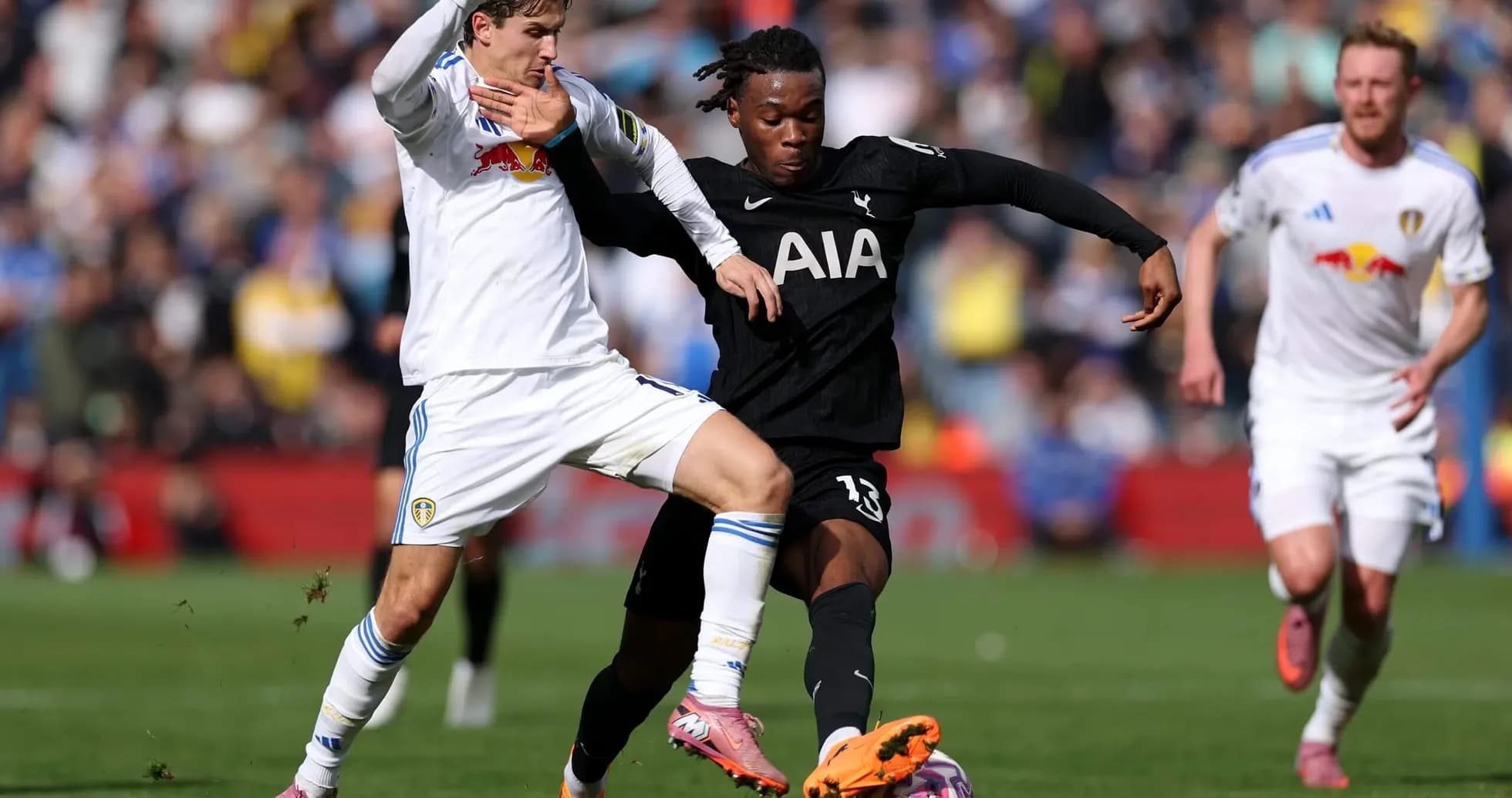 Player tackling during Tottenham vs Leeds match Player tackling during Tottenham vs Leeds match