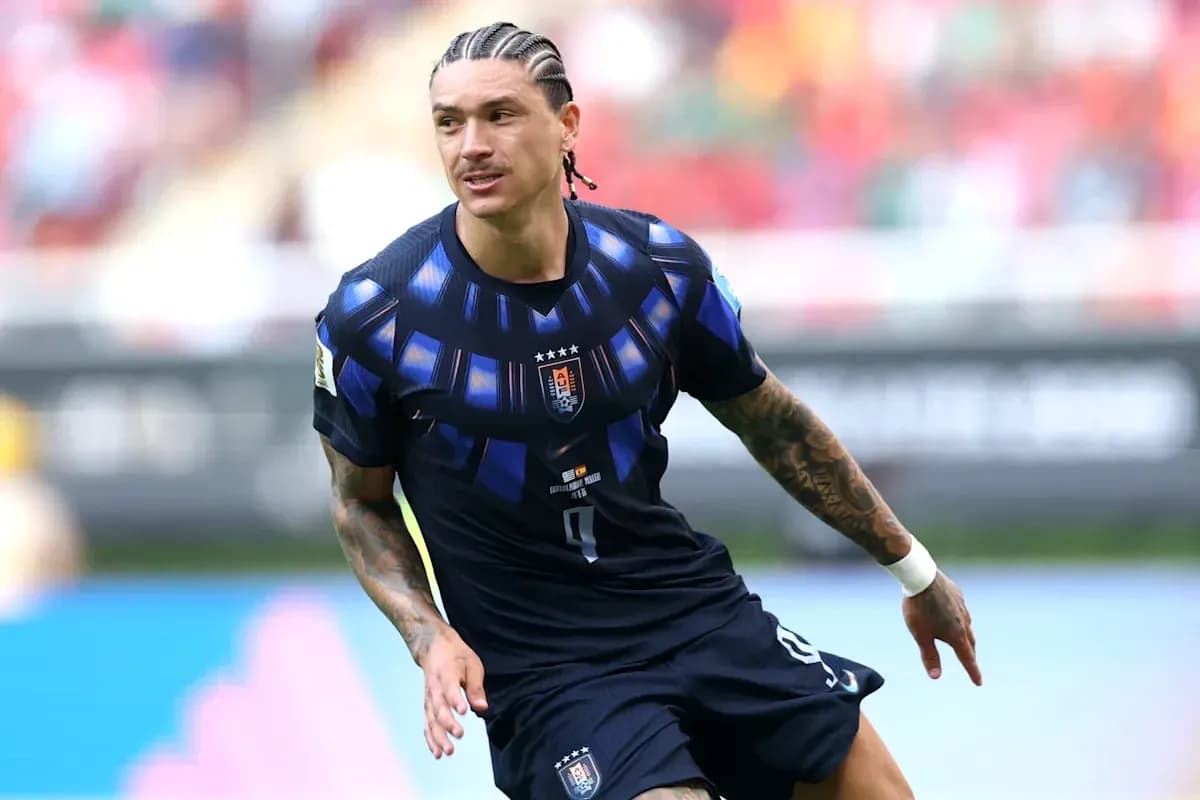 Player in dark jersey running on the field Player in dark jersey running on the field