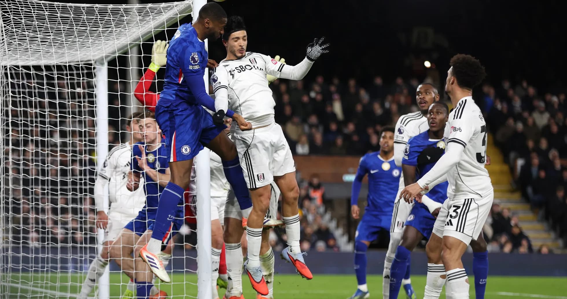 Chelsea player attempting to score against Fulham Chelsea player attempting to score against Fulham