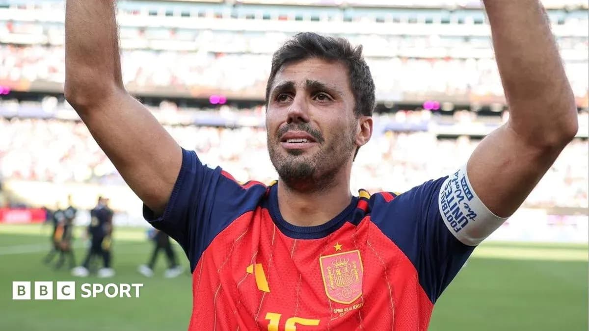 Player celebrating with raised arms in Spain jersey Player celebrating with raised arms in Spain jersey