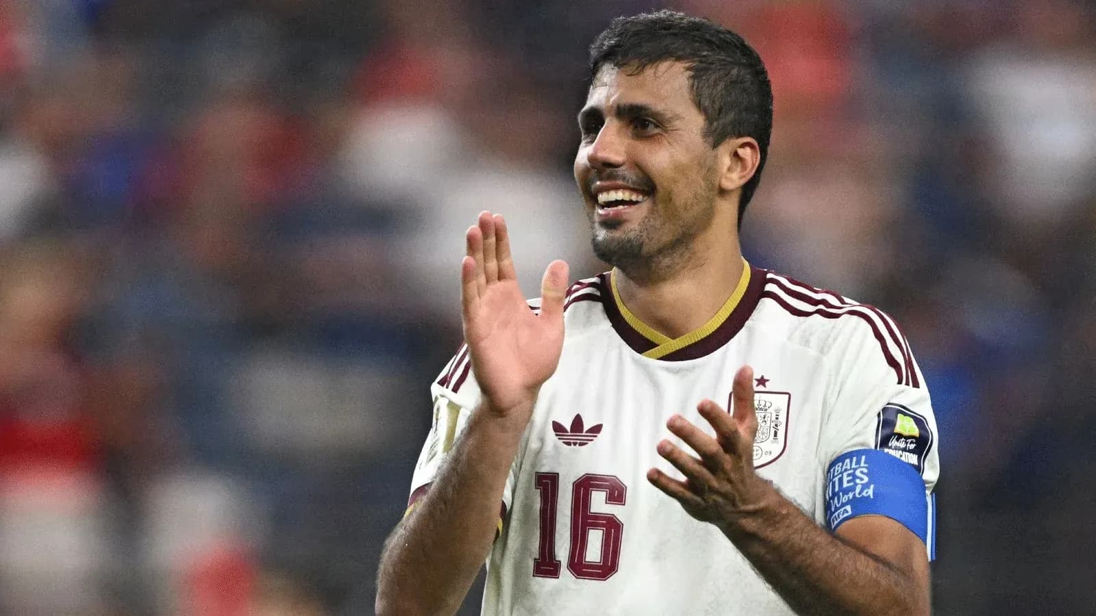 Player celebrating and applauding during a match Player celebrating and applauding during a match