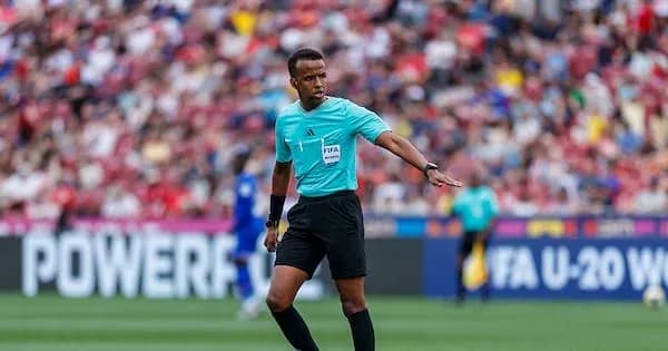Referee signaling during a football match Referee signaling during a football match