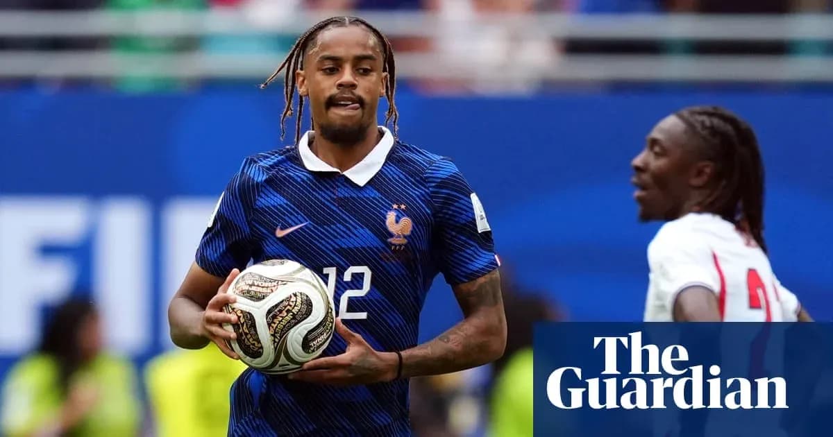 Player in France kit holding soccer ball during match Player in France kit holding soccer ball during match