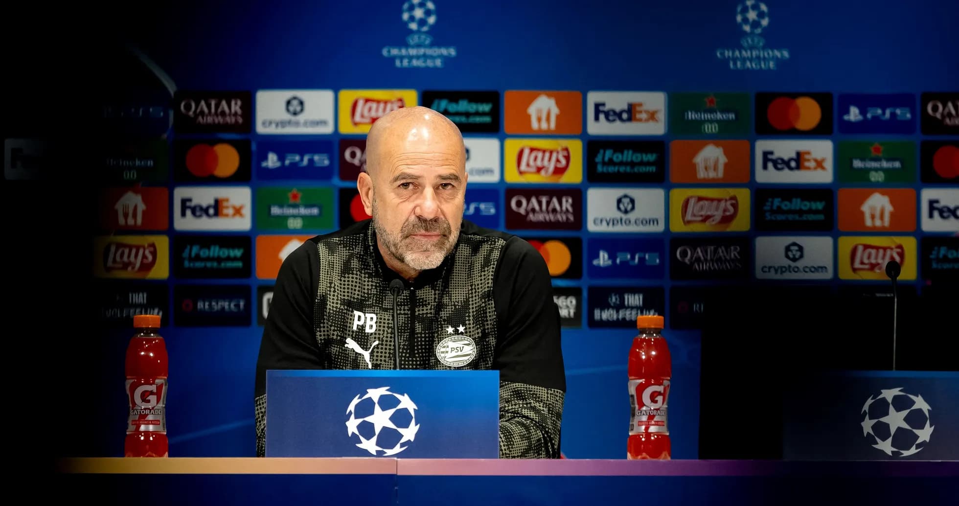 Coach at Champions League press conference podium Coach at Champions League press conference podium