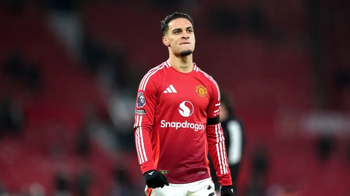 Player celebrating on the pitch in Manchester United kit Player celebrating on the pitch in Manchester United kit