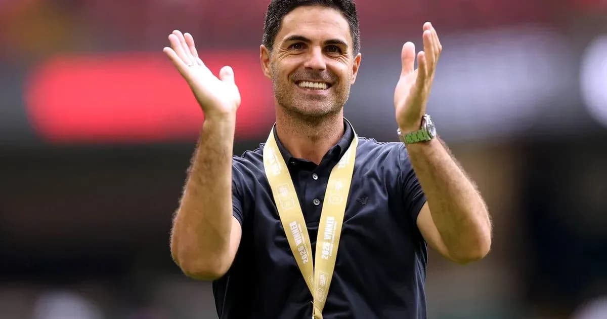 Coach celebrating with hands raised at event Coach celebrating with hands raised at event