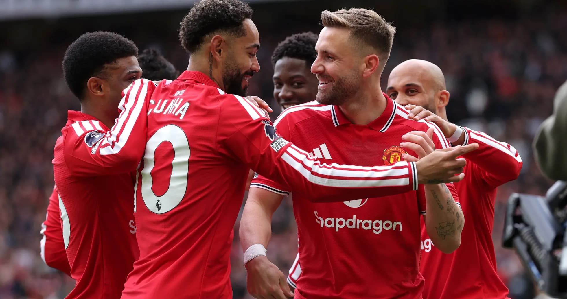 Manchester United players celebrating a goal together Manchester United players celebrating a goal together