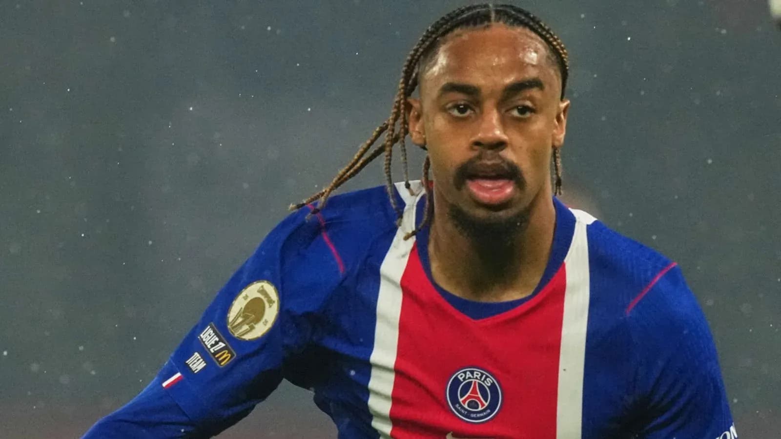 Player in action wearing PSG jersey during match Player in action wearing PSG jersey during match