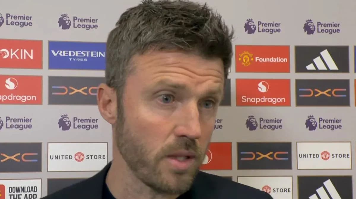 Manager speaking at press conference with logos behind Manager speaking at press conference with logos behind
