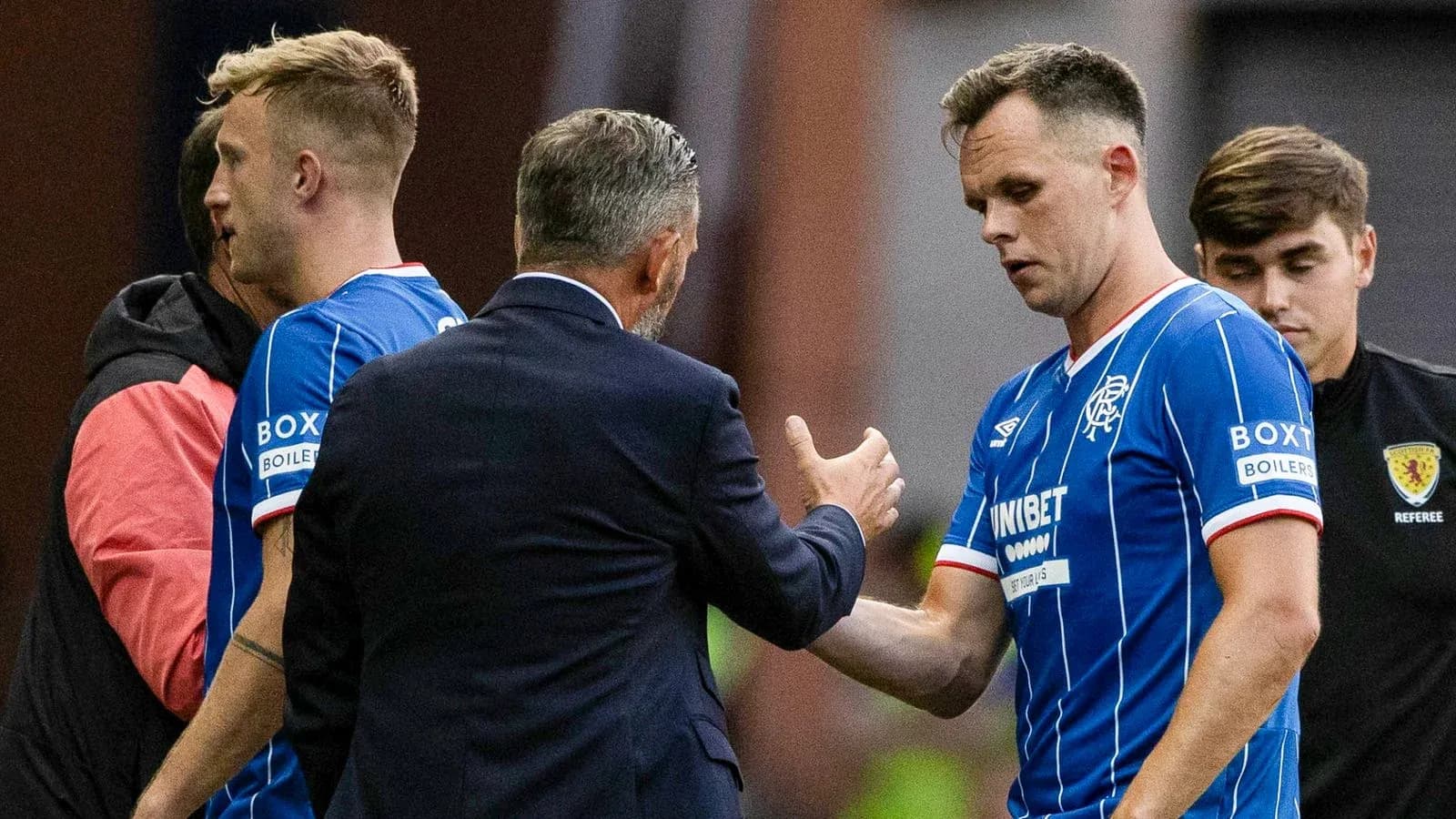 Rangers players interacting with manager during substitution Rangers players interacting with manager during substitution