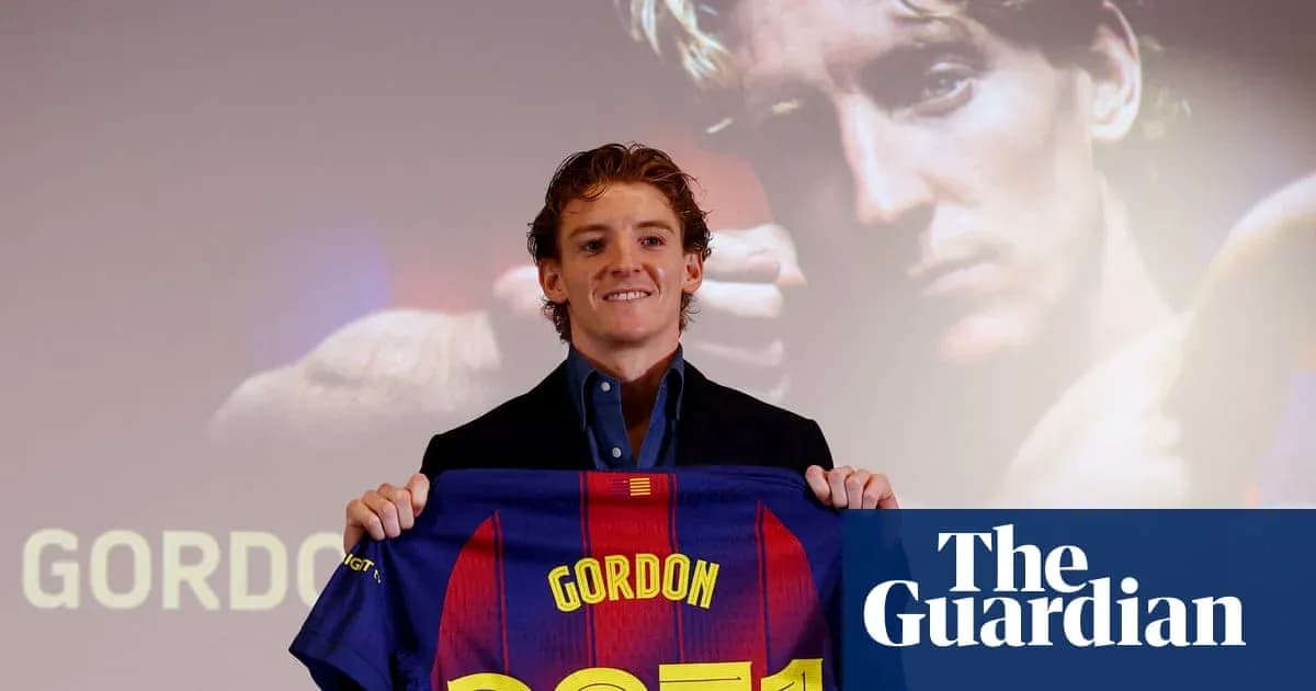 Player holding Barcelona jersey at presentation event Player holding Barcelona jersey at presentation event