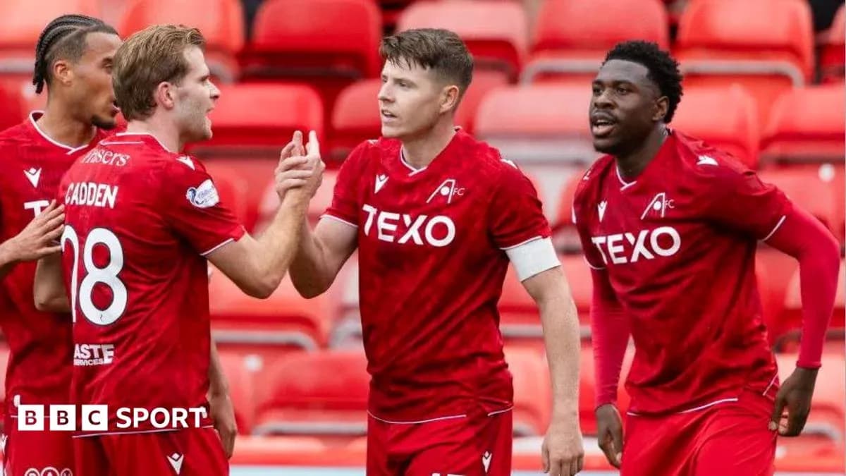 Players celebrating a goal during a match Players celebrating a goal during a match