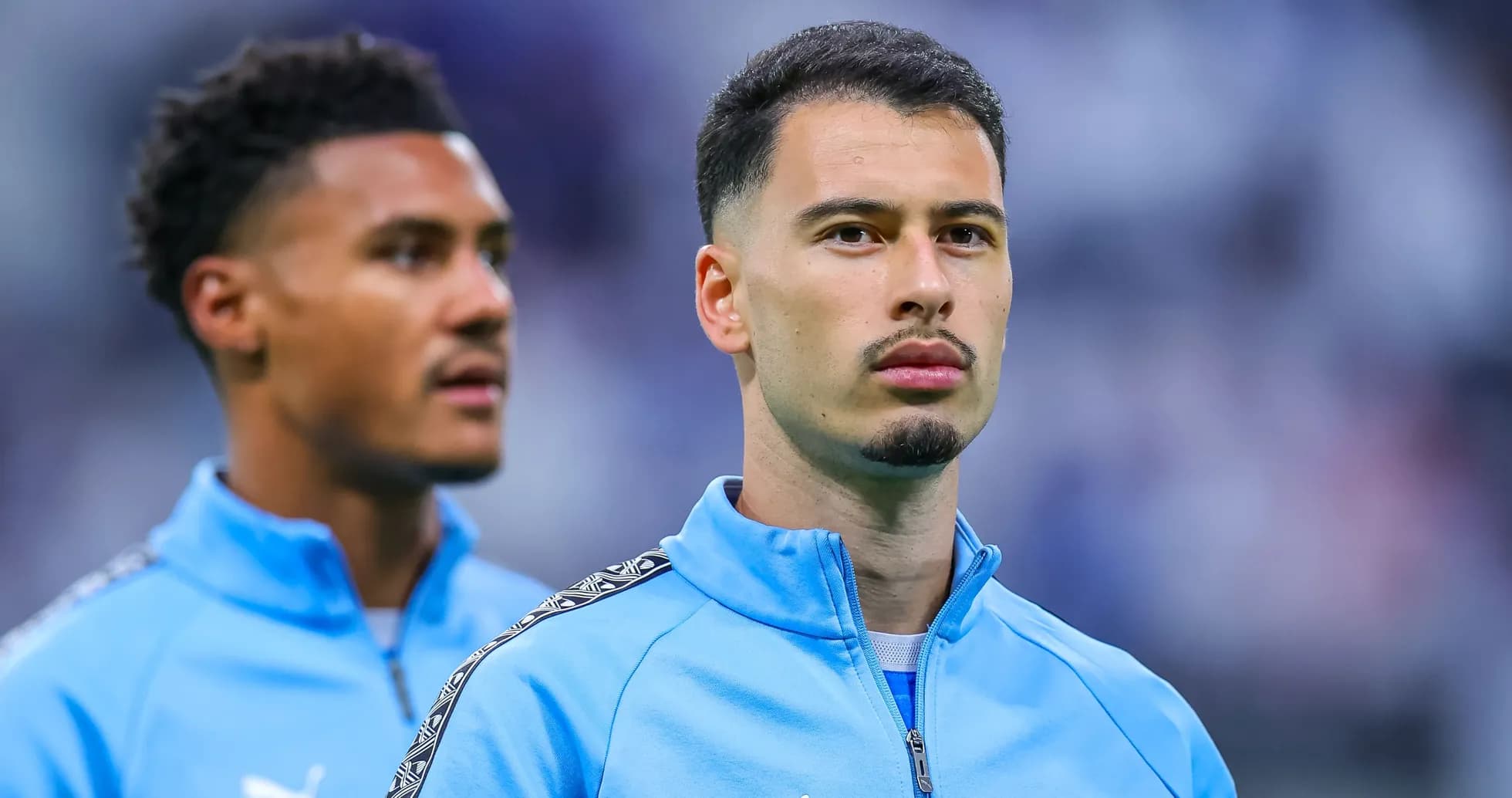 Two players in blue training jackets before match Two players in blue training jackets before match