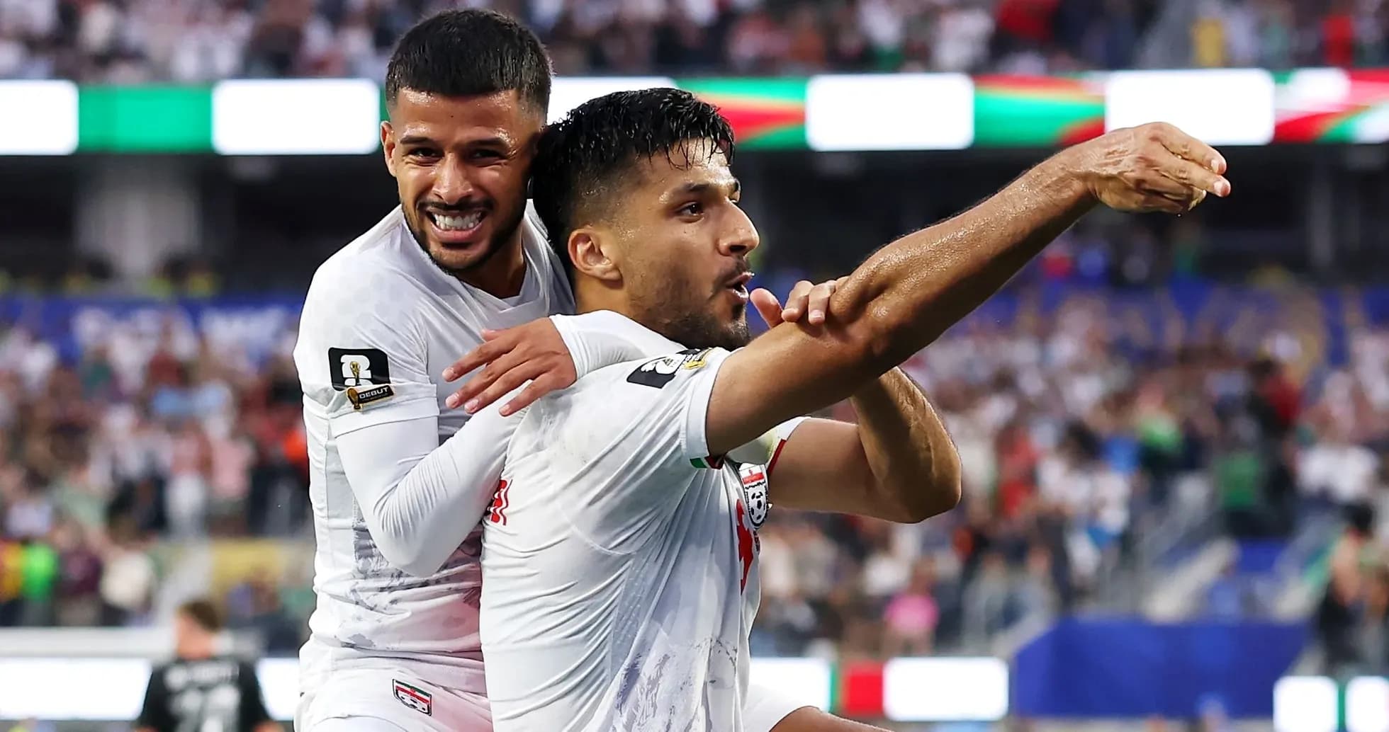 Two players celebrating a goal during a match Two players celebrating a goal during a match