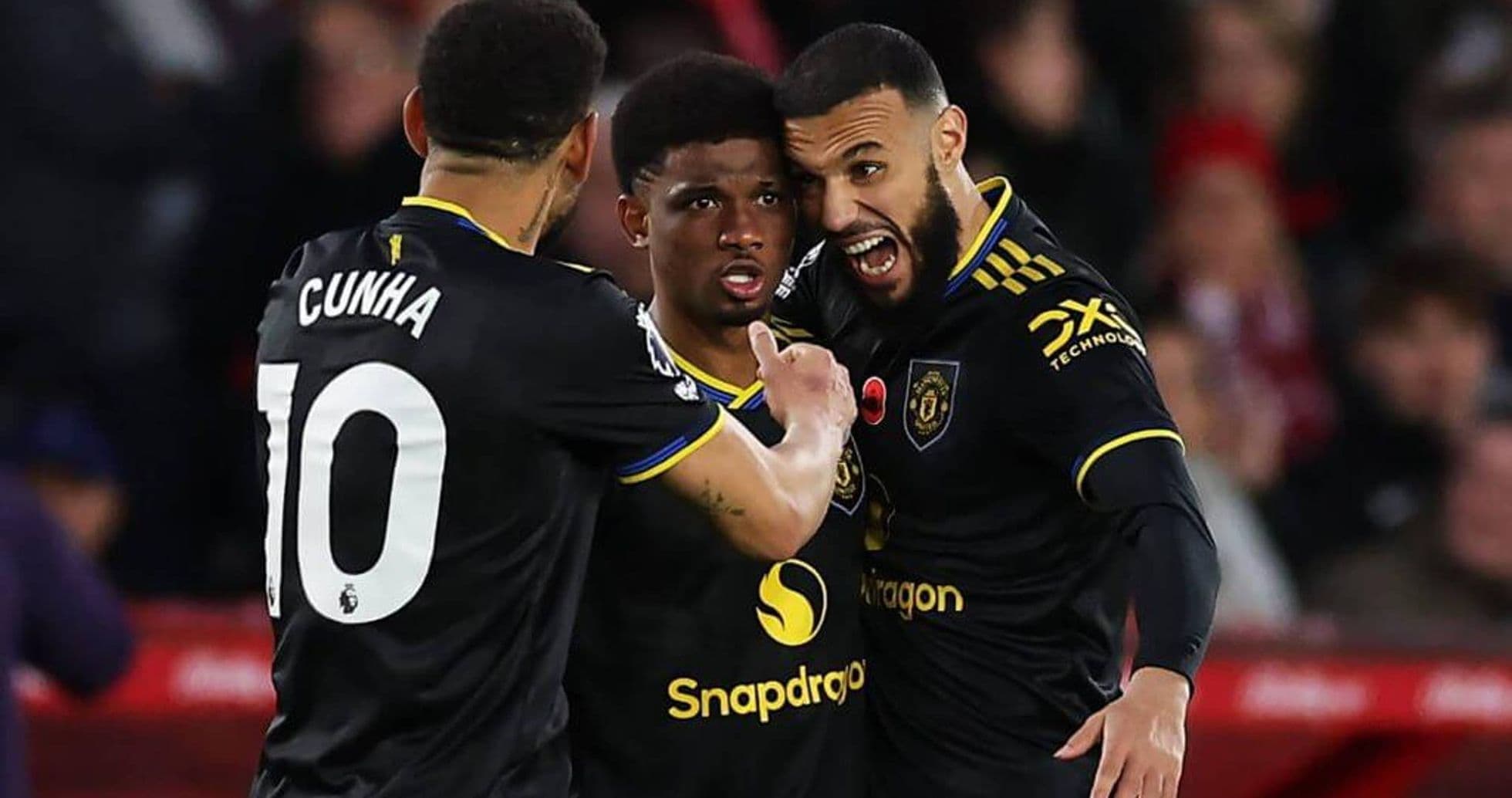 Manchester United players celebrating a goal Manchester United players celebrating a goal