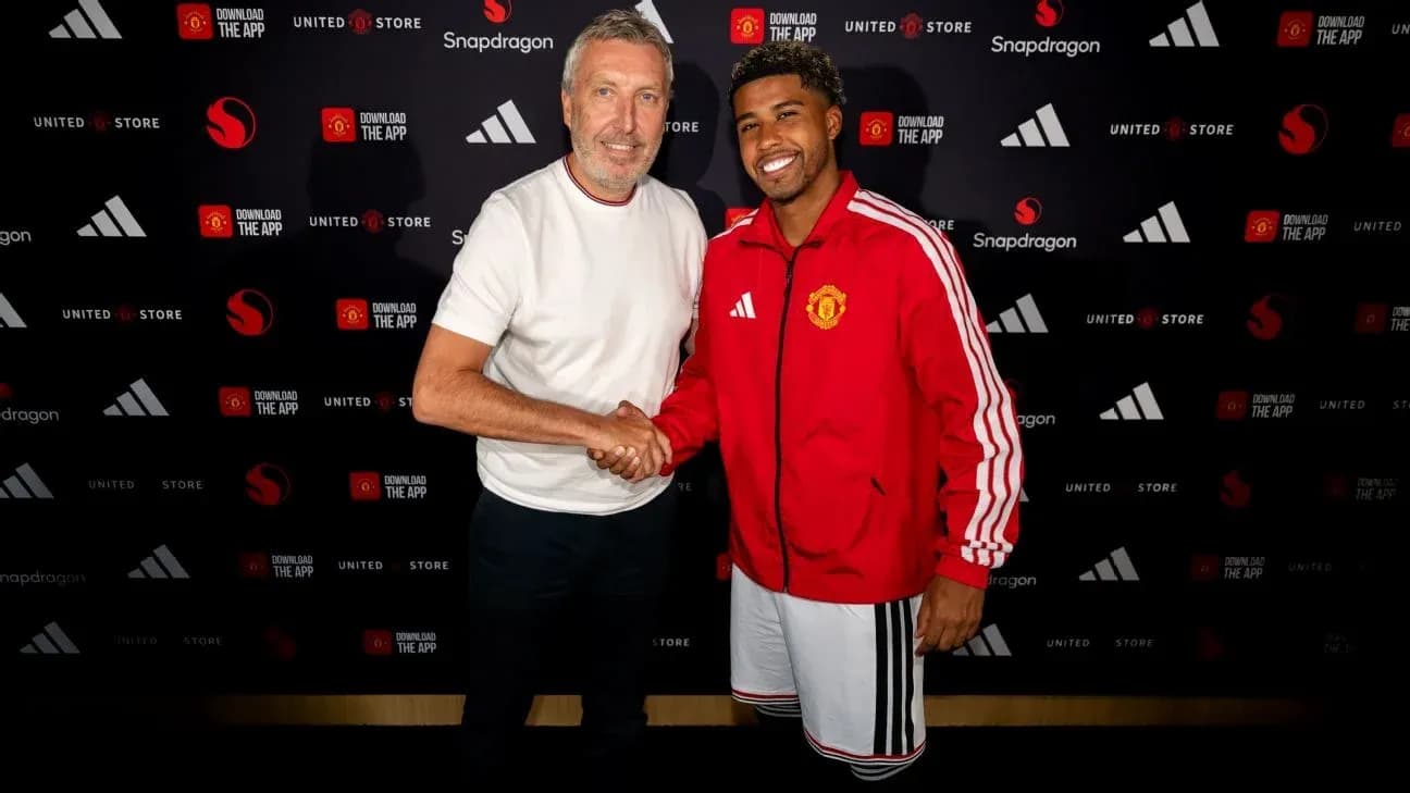 Two men shaking hands at Manchester United event Two men shaking hands at Manchester United event