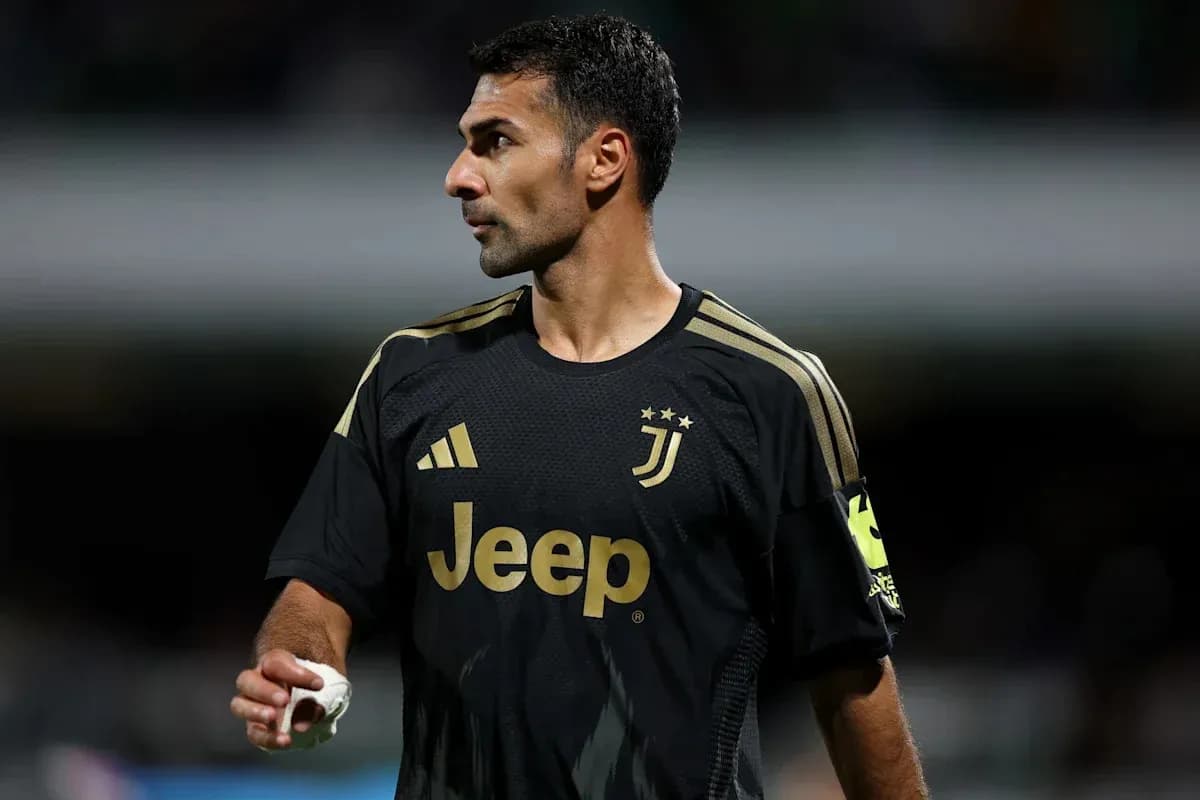 Juventus player in black kit during match Juventus player in black kit during match