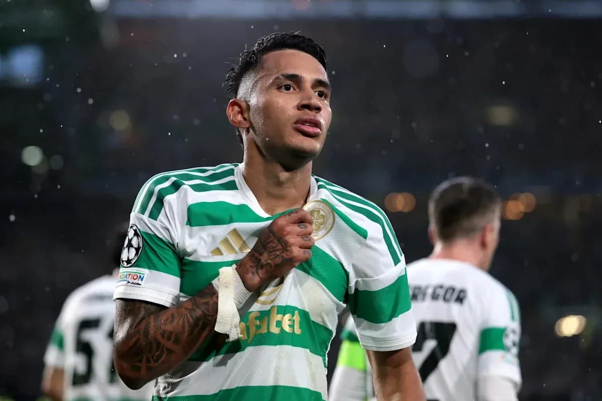 Player celebrating in Celtic's green and white jersey Player celebrating in Celtic's green and white jersey
