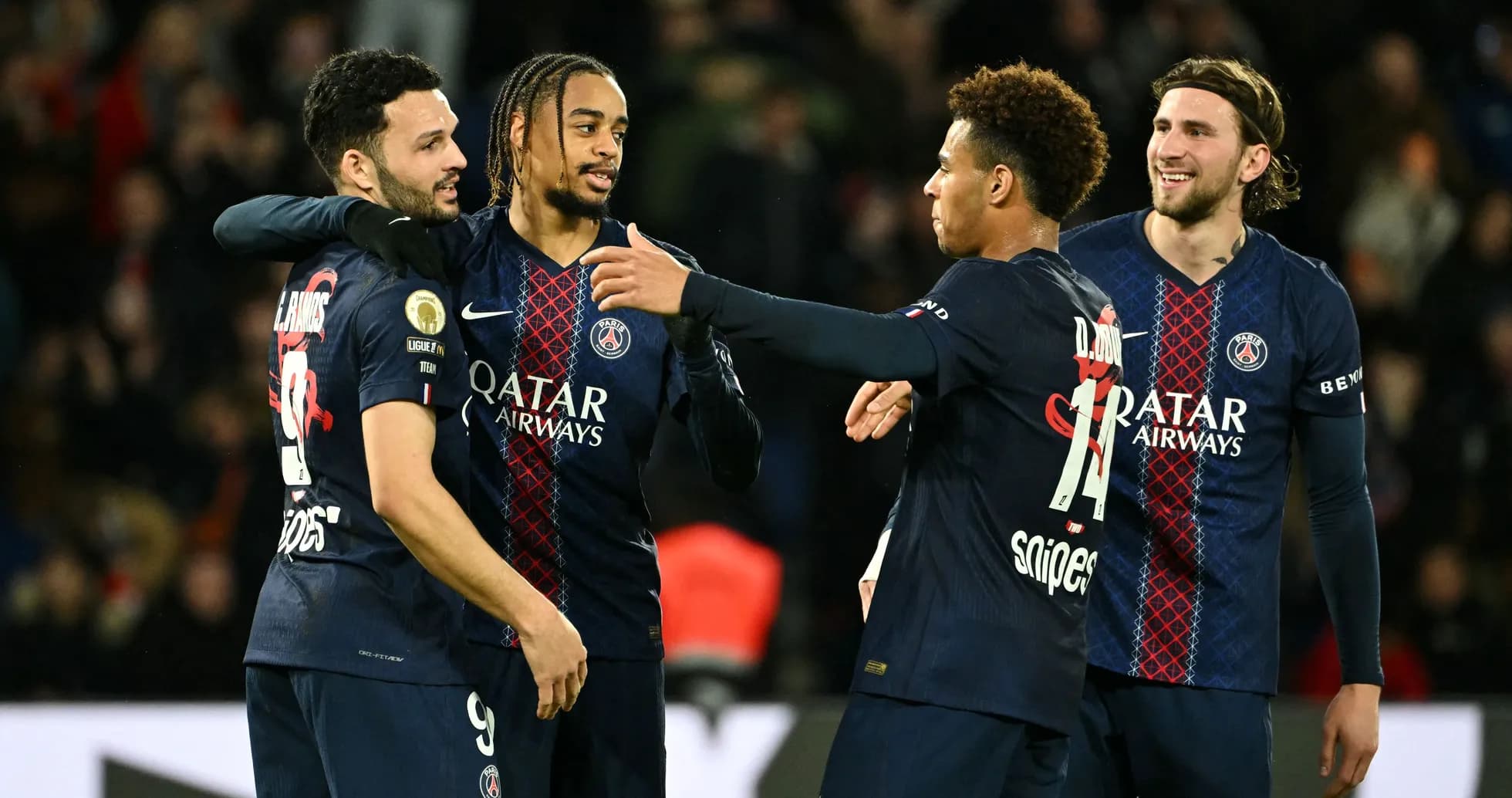 Paris Saint-Germain players celebrating together on field Paris Saint-Germain players celebrating together on field
