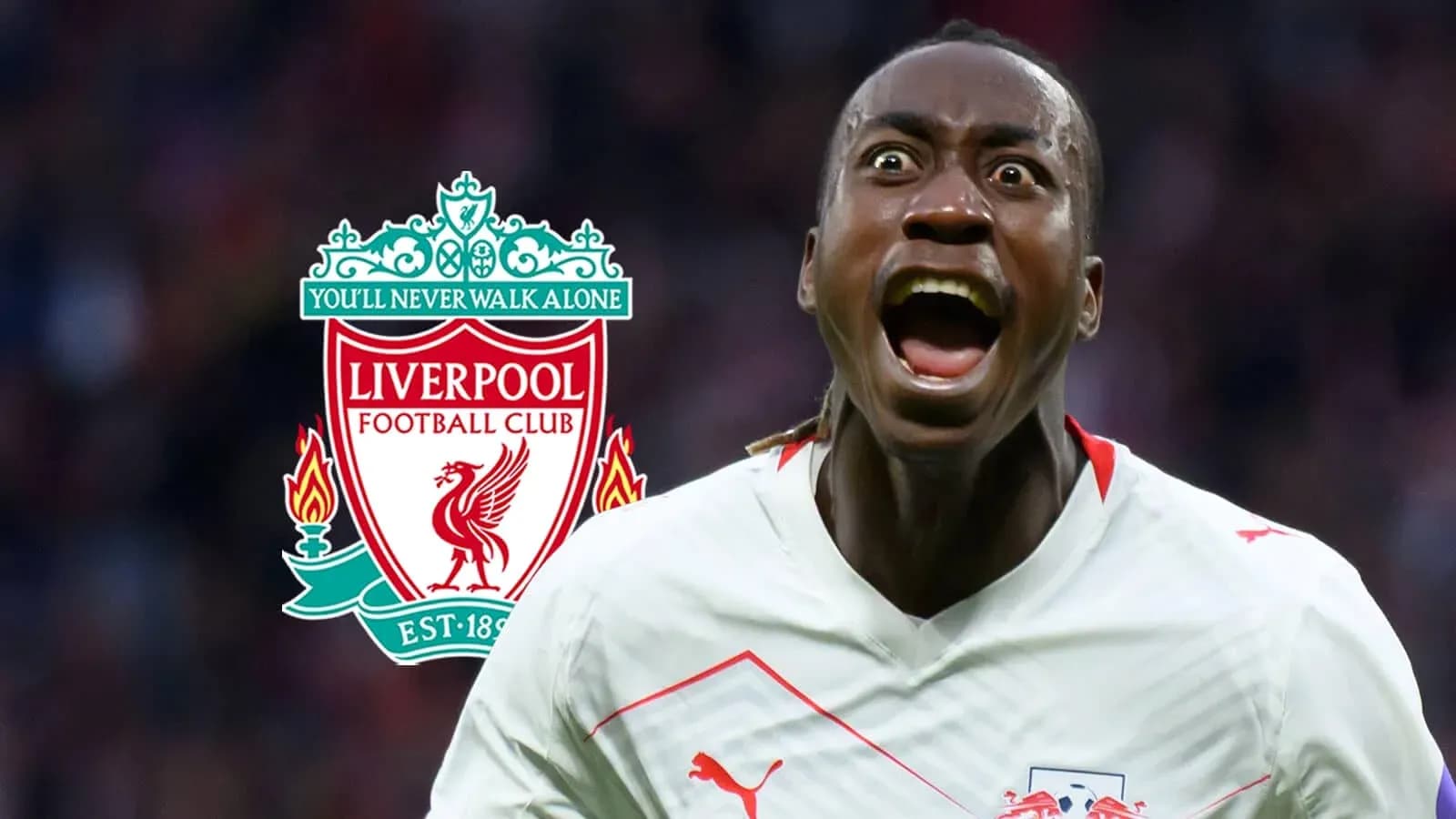 Player celebrating in front of Liverpool FC logo Player celebrating in front of Liverpool FC logo