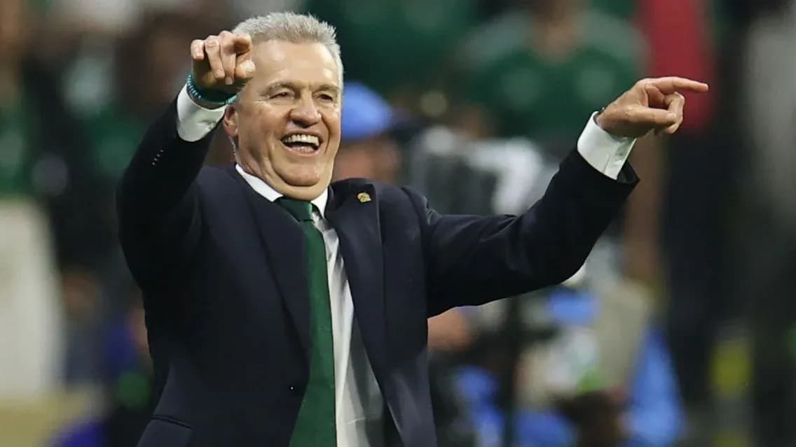 Coach celebrating and pointing during match Coach celebrating and pointing during match