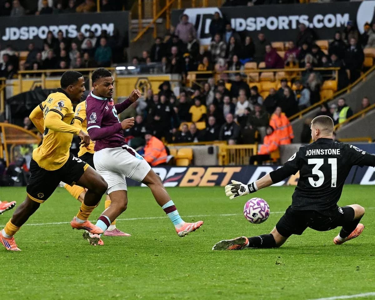 Burnley player attempting to score against Wolves Burnley player attempting to score against Wolves