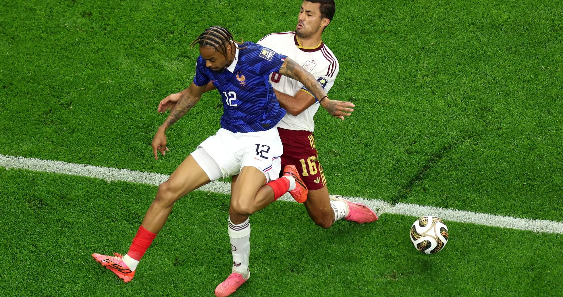 Two players challenging for the ball during match Two players challenging for the ball during match