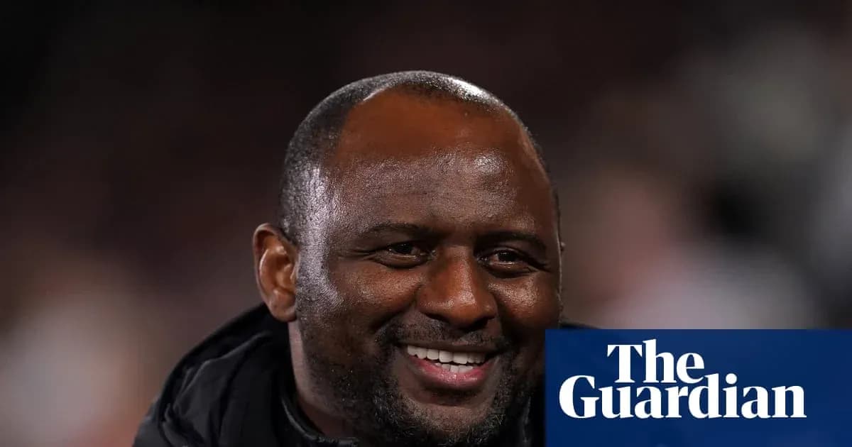 Smiling coach during a football match event Smiling coach during a football match event