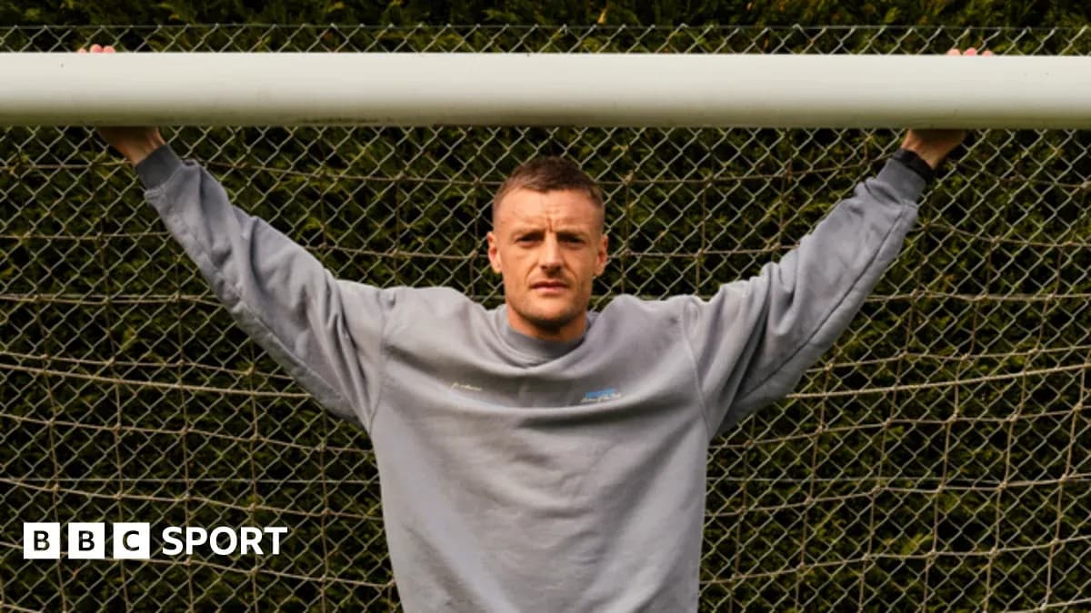 Player posing with arms on goalpost Player posing with arms on goalpost