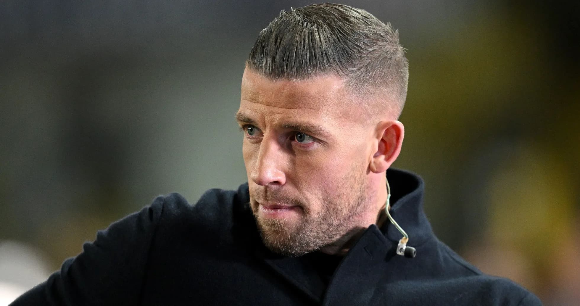 Man with short hair in a black coat Man with short hair in a black coat