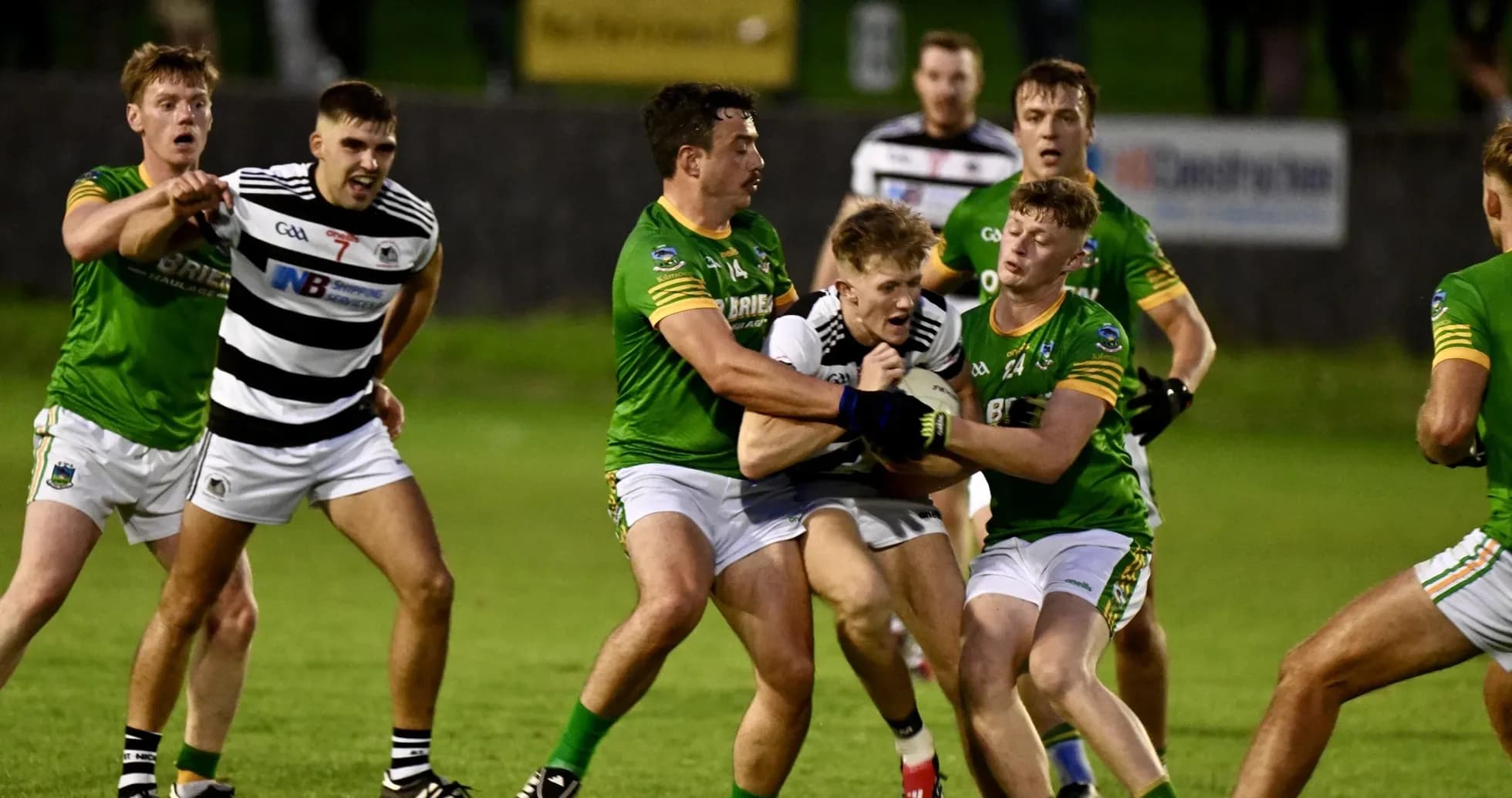 Players in action during a competitive Gaelic football match Players in action during a competitive Gaelic football match