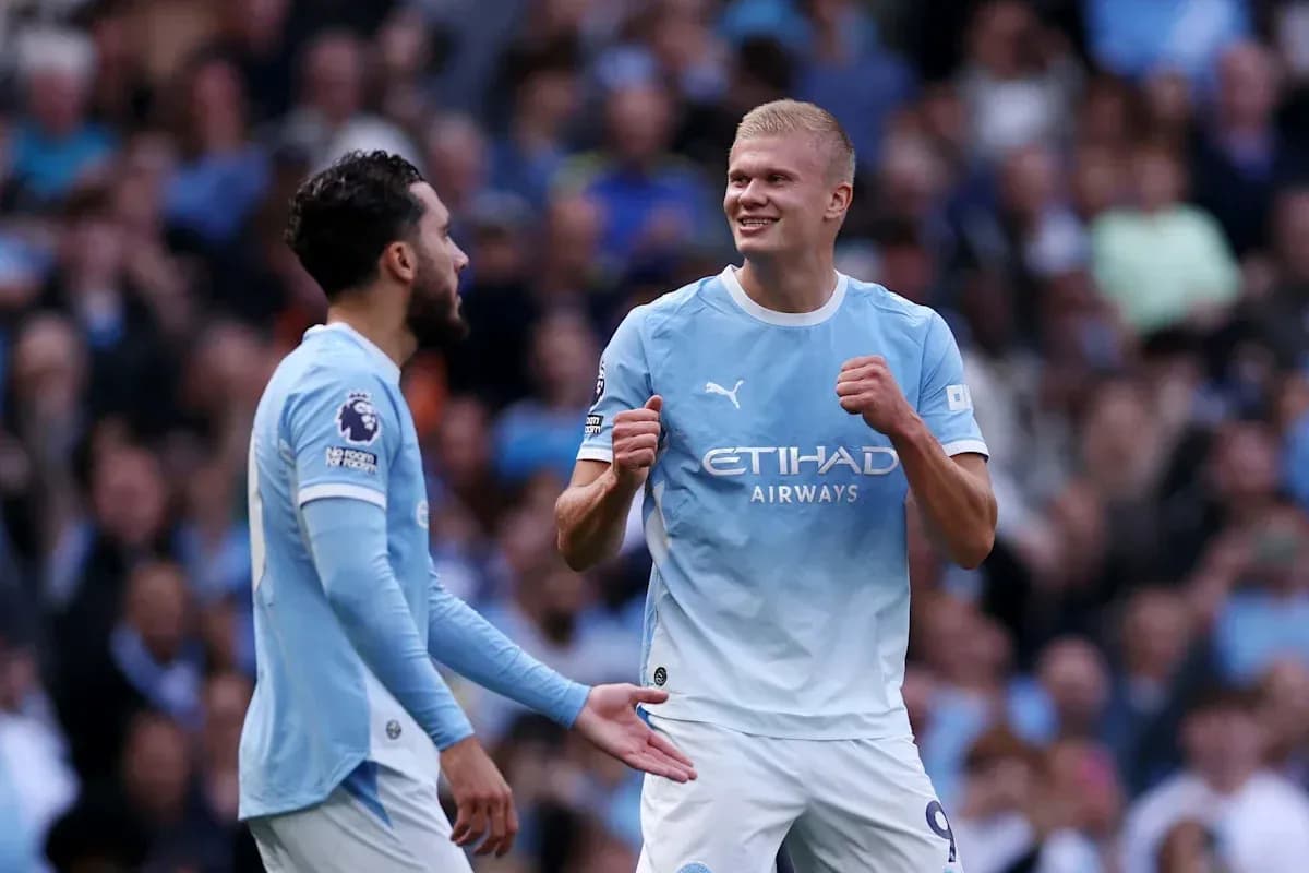 Manchester City players celebrating during a match Manchester City players celebrating during a match