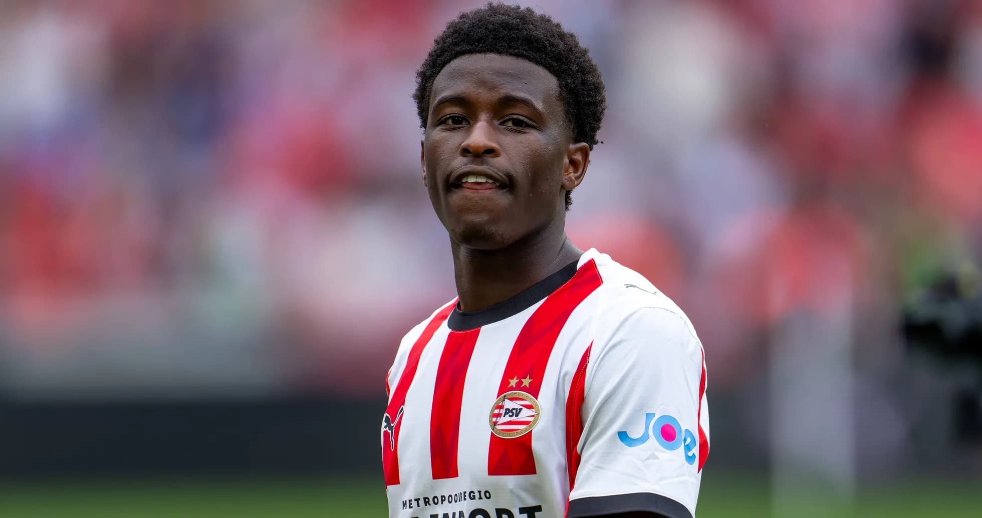 Player in PSV kit during match warm-up Player in PSV kit during match warm-up