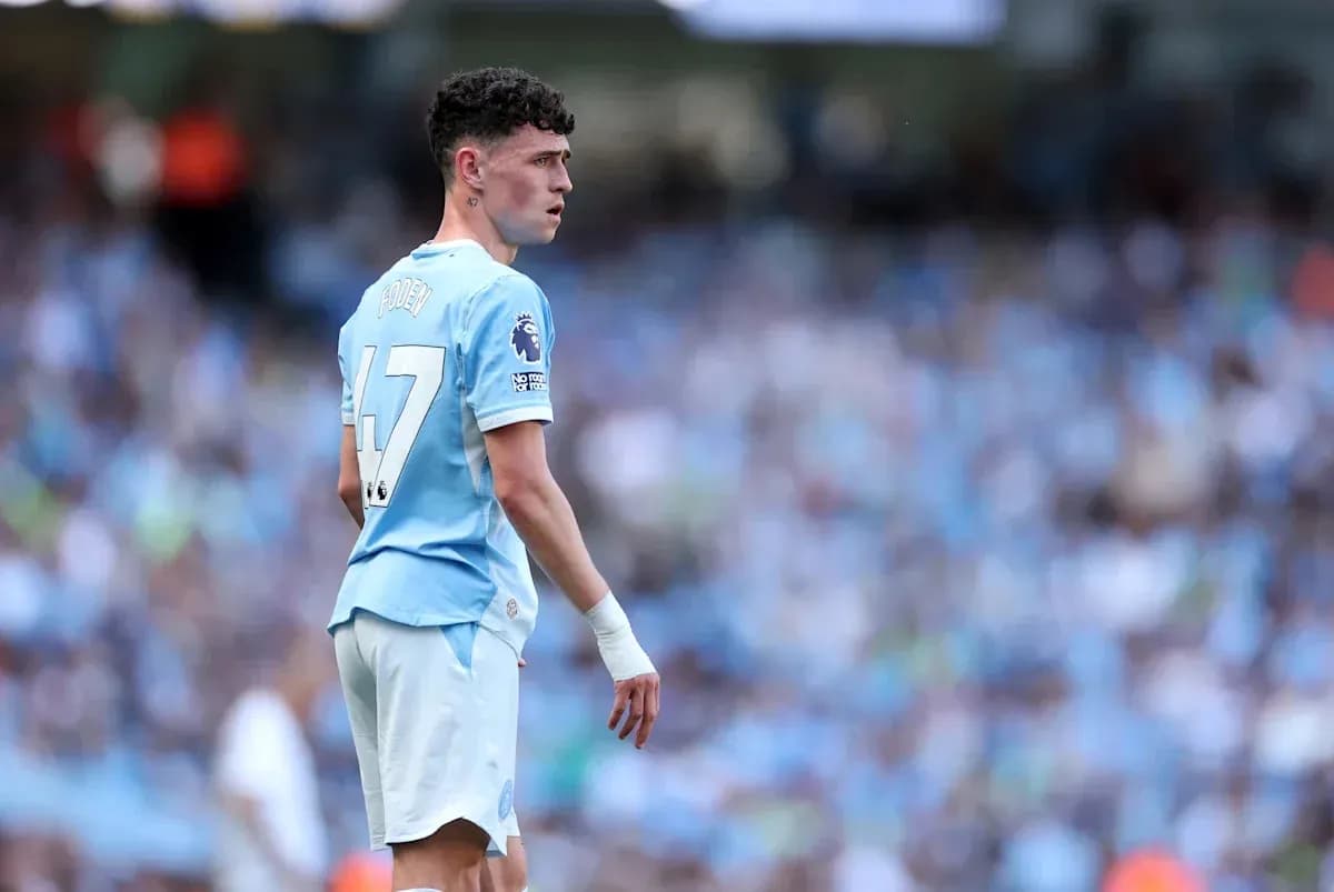 Phil Foden in Manchester City kit on the pitch Phil Foden in Manchester City kit on the pitch