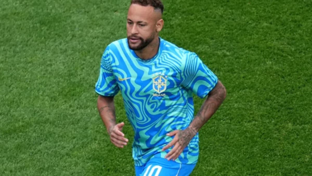 Player in Brazil kit running on the field Player in Brazil kit running on the field