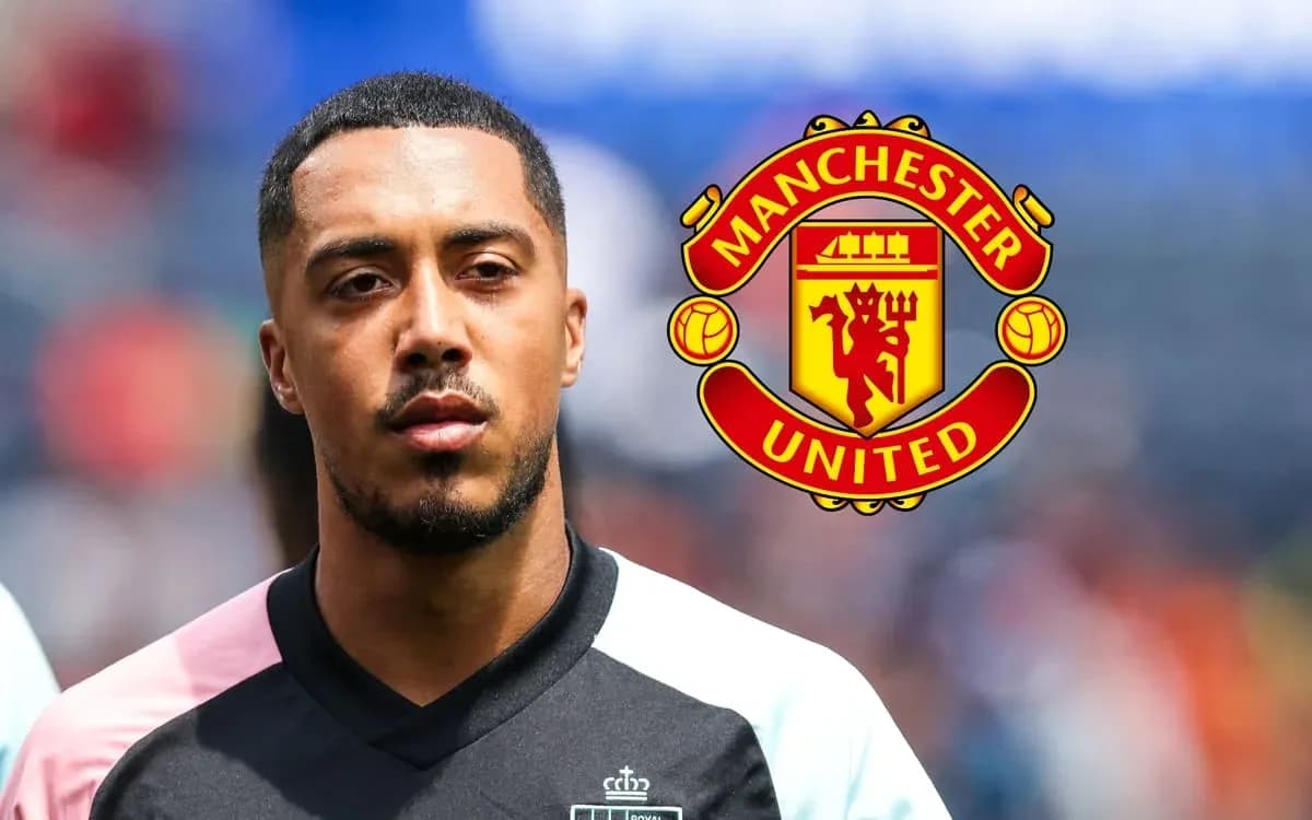 Player in jersey with Manchester United logo behind Player in jersey with Manchester United logo behind