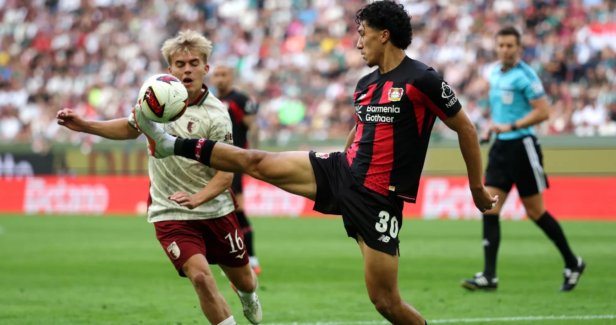 Player kicking ball during match action Player kicking ball during match action