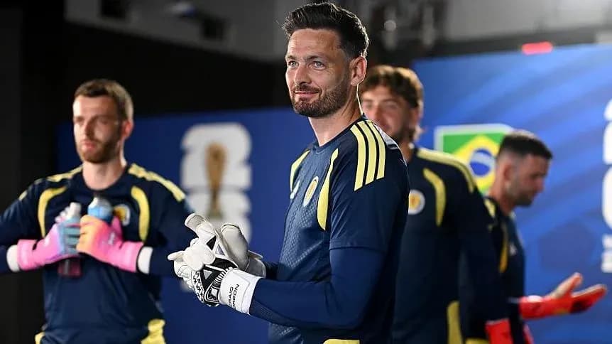 Goalkeeper with teammates preparing for match Goalkeeper with teammates preparing for match